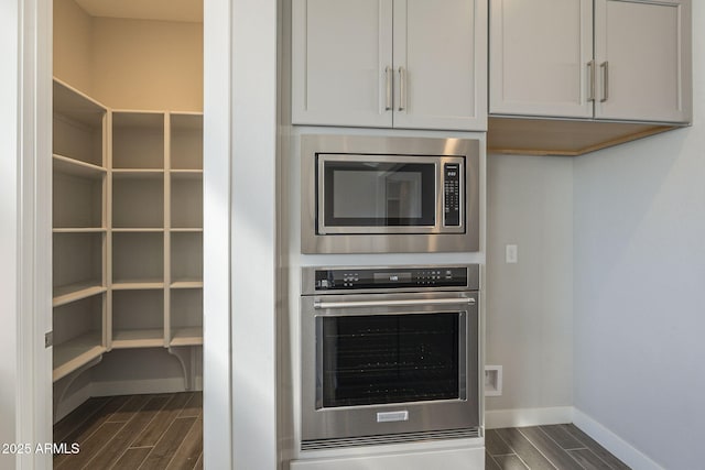10972 N Hershey St, Surprise, AZ 85388 - kitchen featuring appliances with stainless steel finishes, wood finish floors, and baseboards