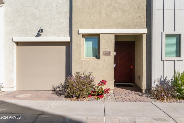 property entrance with a garage