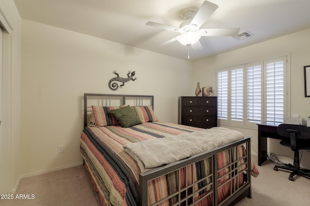 carpeted bedroom featuring ceiling fan