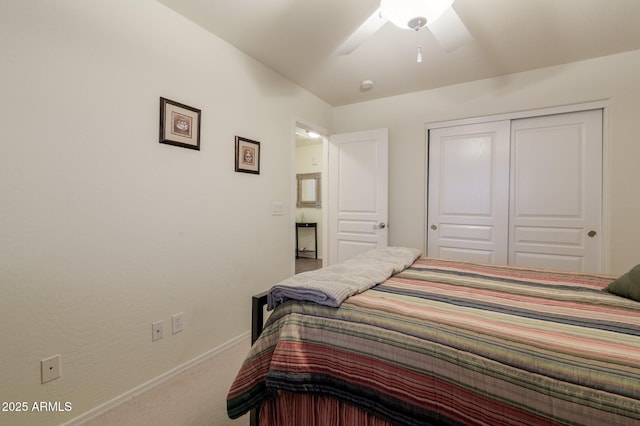 bedroom featuring ceiling fan, a closet, and carpet