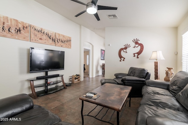 tiled living room featuring ceiling fan