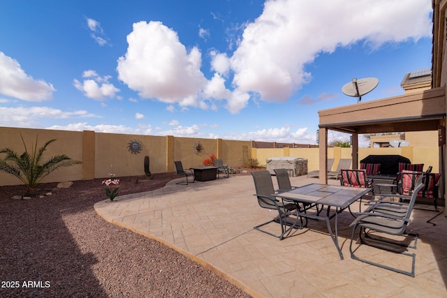 view of patio featuring a jacuzzi