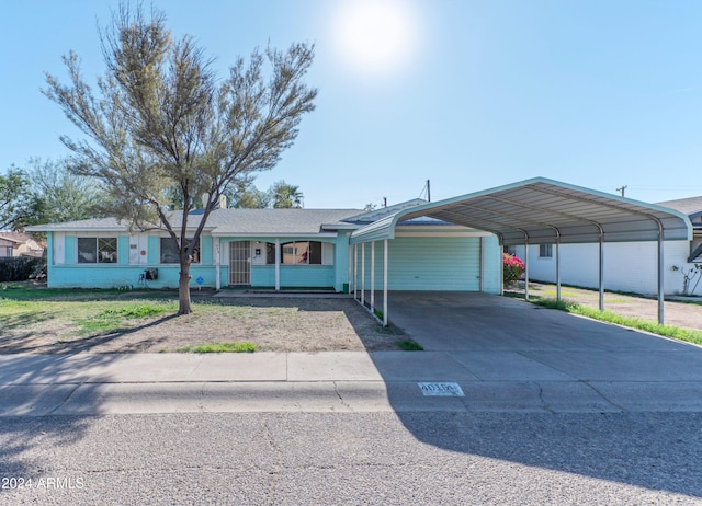 ranch-style home with a carport