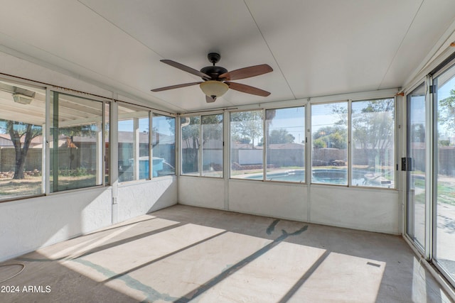 unfurnished sunroom featuring plenty of natural light and ceiling fan