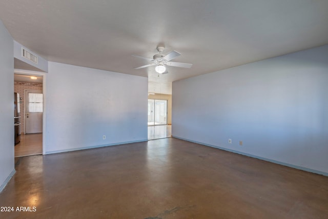 unfurnished room featuring plenty of natural light and ceiling fan