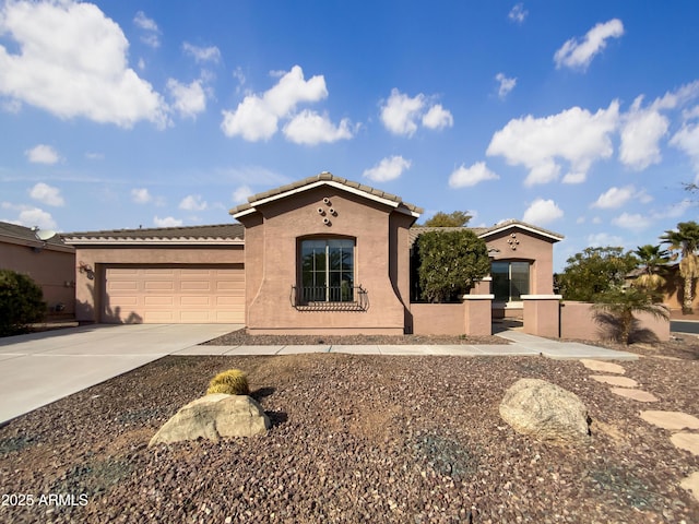 mediterranean / spanish-style home featuring a garage