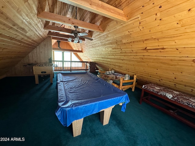 carpeted bedroom with wooden ceiling, wooden walls, and vaulted ceiling with beams