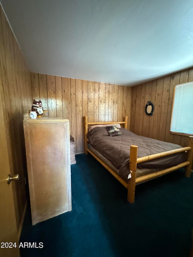 bedroom featuring dark colored carpet