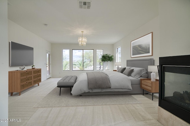 bedroom featuring light carpet, visible vents, and an inviting chandelier