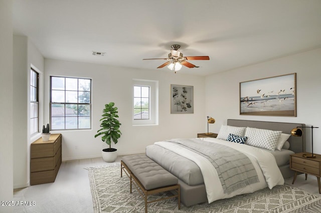 bedroom with visible vents, carpet floors, baseboards, and ceiling fan