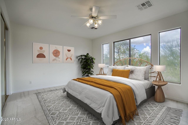 bedroom featuring visible vents, baseboards, and carpet