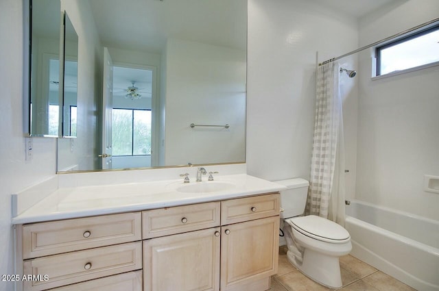 full bath featuring vanity, shower / bathtub combination with curtain, ceiling fan, tile patterned floors, and toilet