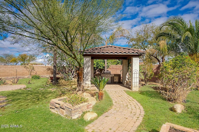 view of yard with exterior kitchen and a fenced backyard