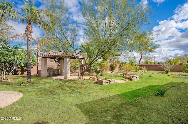 view of yard with a gazebo and fence