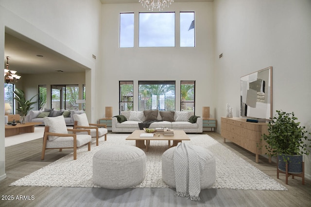 living area with light wood finished floors, visible vents, and an inviting chandelier