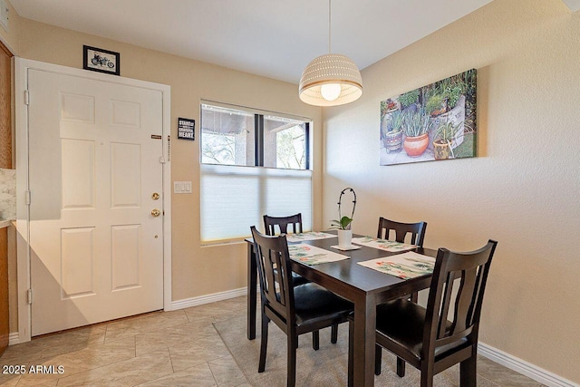 dining room featuring baseboards