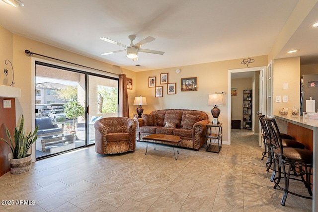 living area with a ceiling fan