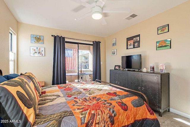 tiled bedroom with access to exterior, visible vents, ceiling fan, and baseboards