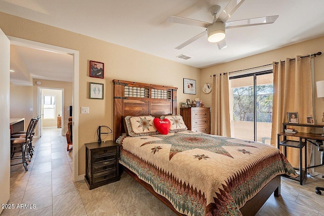 bedroom with access to outside, multiple windows, visible vents, and a ceiling fan