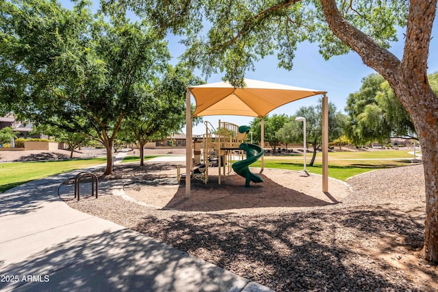 community play area with a lawn