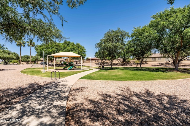 view of property's community featuring a yard and playground community