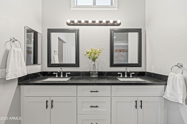 bathroom with double vanity and a sink