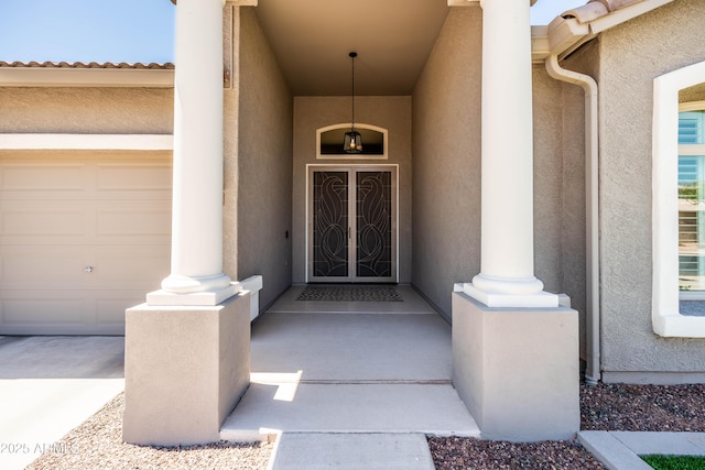 entrance to property with stucco siding