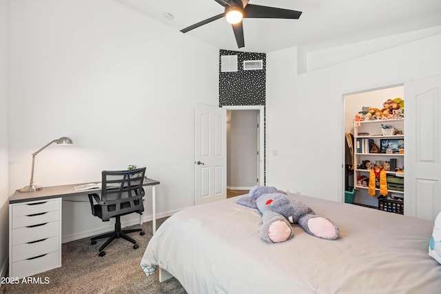 carpeted bedroom featuring ceiling fan and visible vents