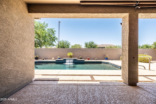 view of swimming pool featuring a patio, a fenced in pool, and a fenced backyard