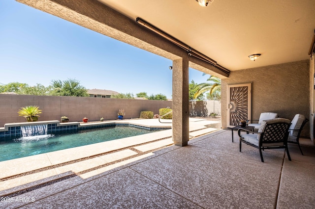 view of pool with a fenced in pool, a fenced backyard, and a patio area