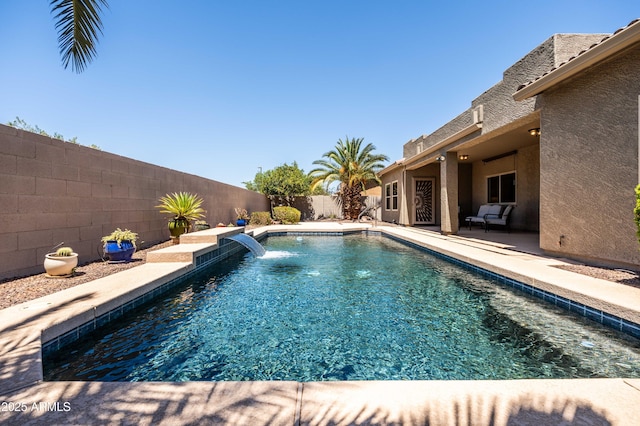 view of swimming pool with a fenced backyard, a fenced in pool, and a patio area