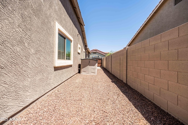 view of property exterior with a fenced backyard and stucco siding