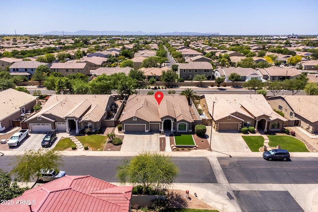 aerial view with a mountain view and a residential view