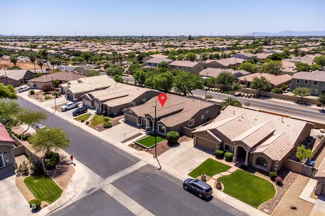 drone / aerial view with a residential view and a mountain view