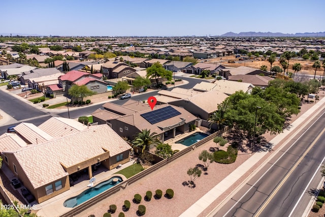 birds eye view of property with a residential view and a mountain view