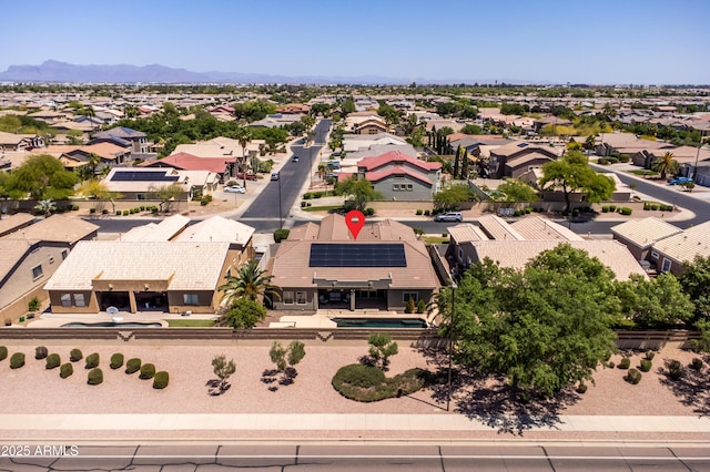 birds eye view of property featuring a mountain view and a residential view