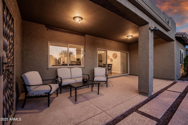 patio terrace at dusk with outdoor lounge area