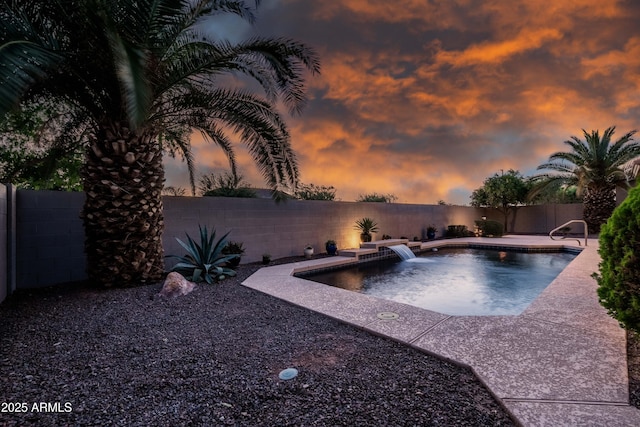 view of swimming pool with a fenced in pool, a fenced backyard, and a patio