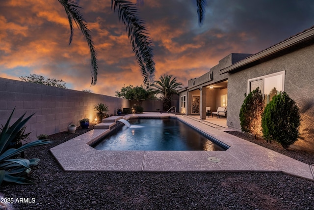 view of swimming pool with a fenced in pool, a fenced backyard, and a patio area