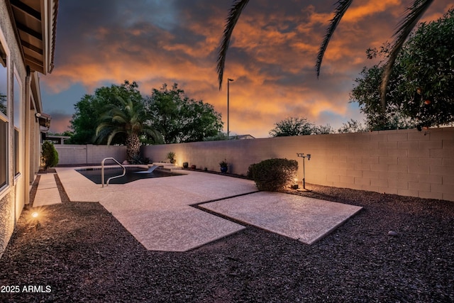 view of yard with a fenced backyard and a patio area