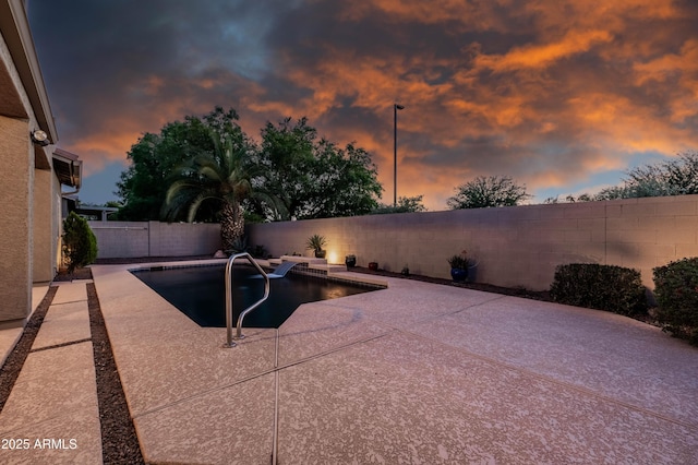 view of pool featuring a patio, a fenced backyard, and a fenced in pool