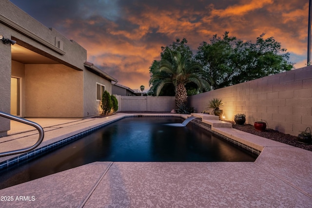 pool at dusk with a patio, a fenced backyard, and a fenced in pool