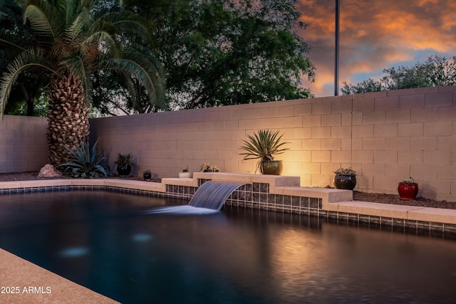 view of pool with fence