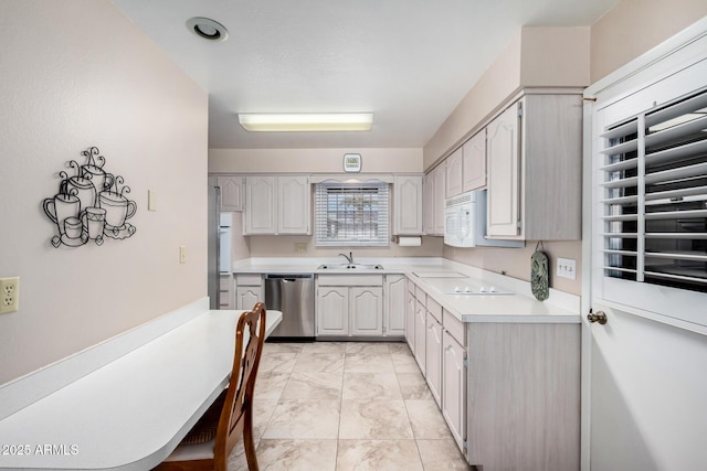 kitchen with sink and appliances with stainless steel finishes