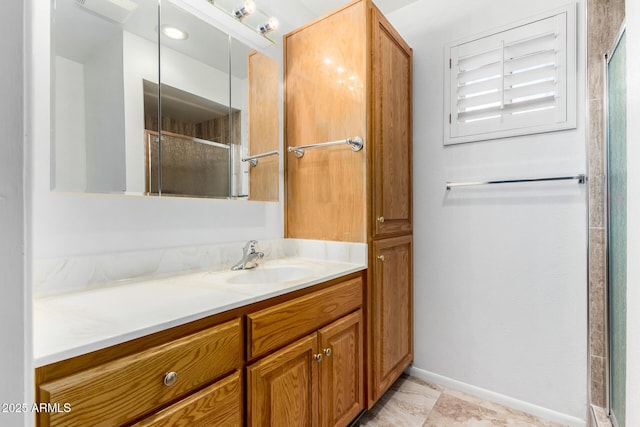 bathroom featuring vanity and an enclosed shower