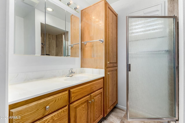 bathroom with vanity and an enclosed shower