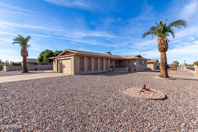 ranch-style home featuring a garage