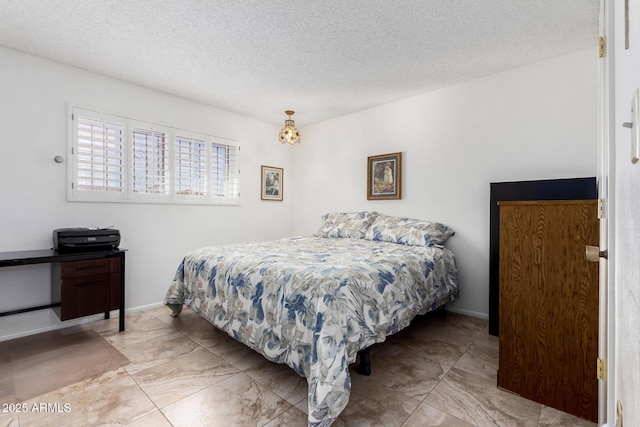 bedroom featuring a textured ceiling