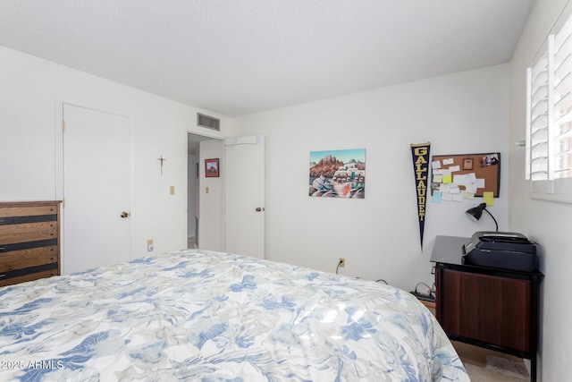 bedroom featuring a textured ceiling