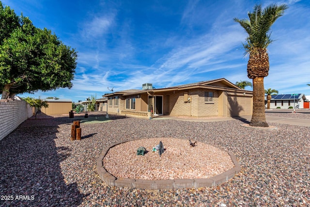 rear view of house with a patio